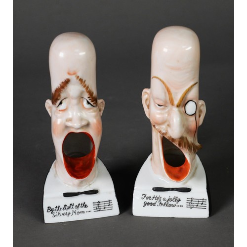 100 - A PAIR OF PORCELAIN SMOKING HEAD ASHTRAYS, by Schafer & Vater; 'For he's a jolly good fellow' an... 