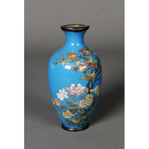 15 - MEIJI PERIDO SMALL OVULAR CLOISONNE VASE decorated with a flowering shrub on a sky blue ground, 4in ... 