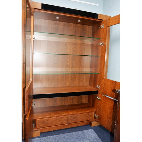 89 - MODERN DISPLAY CABINET, with a pair of glazed cupboard doors enclosing three shelves, set above a pa... 