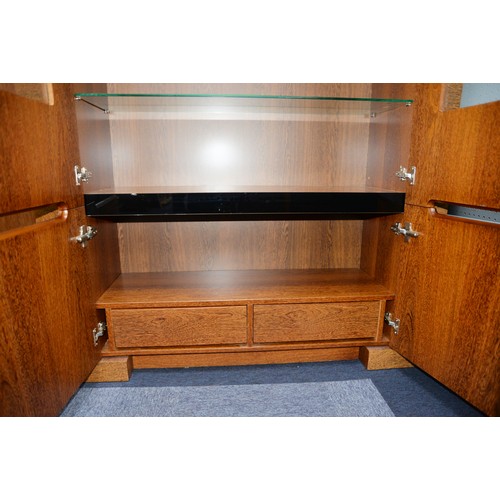 89 - MODERN DISPLAY CABINET, with a pair of glazed cupboard doors enclosing three shelves, set above a pa... 
