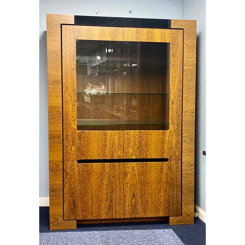 89 - MODERN DISPLAY CABINET, with a pair of glazed cupboard doors enclosing three shelves, set above a pa... 