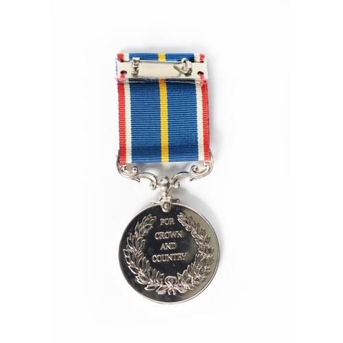 35 - CASED NATIONAL SERVICE MEDAL, with ribbon and plastic card numbered 28022