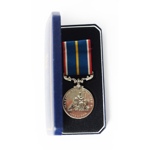 35 - CASED NATIONAL SERVICE MEDAL, with ribbon and plastic card numbered 28022