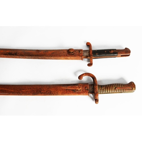 4 - TWO LATE NINETEENTH CENTURY FRENCH BAYONETS IN STEEL SCABBARDS (2) C/R- considerable rusting to both