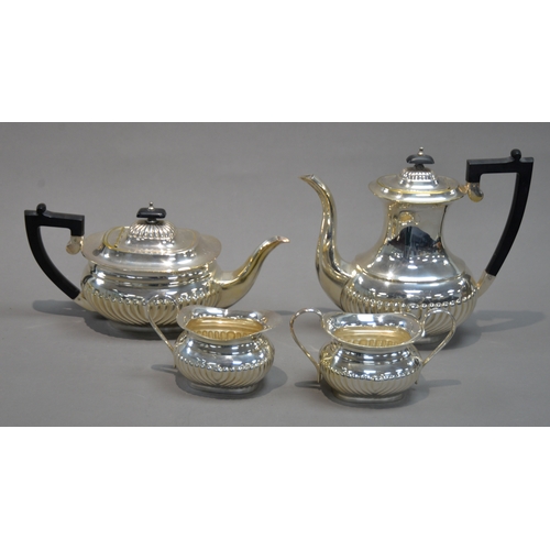 427 - FOUR PIECE GEORGIAN STYLE ELECTROPLATED TEA AND COFFEE SET, of part fluted, rounded oblong form with... 