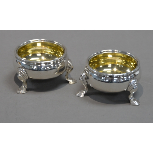 388 - PAIR OF EARLY VICTORIAN SILVER SALT CELLARS with gilded interiors, each on three stepped pad feet, b... 