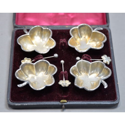 396 - CASED SET OF FOUR LATE VICTORIAN SILVER CLOVER-LEAF SHAPE SALT-CELLARS with MATCHING SPOONS (one abs... 