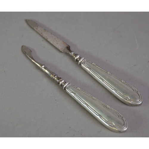 377 - PAIR OF MANICURE IMPLEMENTS WITH FILLED SILVER HANDLES, (2)