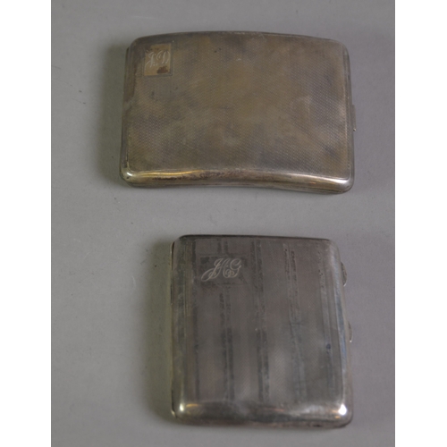 378 - TWO GEORGE V ENGINE TURNED SILVER POCKET CIGARETTE CASES, each of curved oblong form with presentati... 