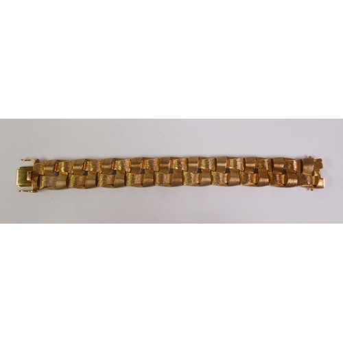 91 - CIRCA 1970S 9CT GOLD BRACELET, of woven textured and brush polished links, import London 1974, 2cm b... 