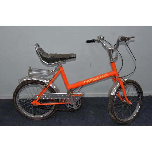 208 - RALEIGH COMMANDO: 1970s pushbike in orange paintwork with fluorescent orange, yellow and black decal... 