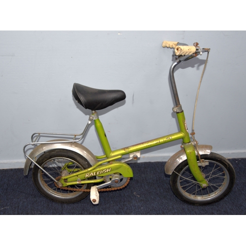 209 - RALEIGH BUDGIE: adapted with later cross-bars and seat, in green paintwork, plus a Raleigh Bluebird ... 