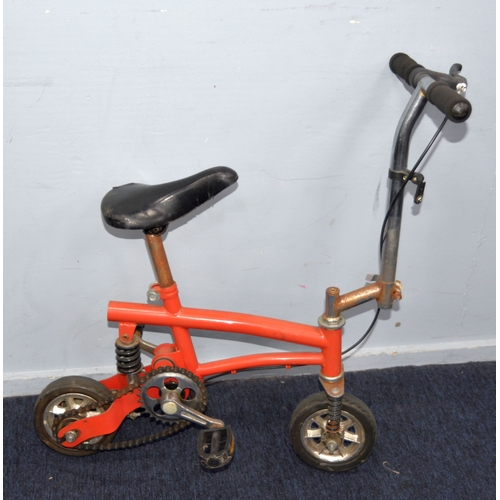 225 - MONKEY BIKE: An unbranded miniature push bike or monkey bike, in orange/red paintwork, 2ft (61 cm) L