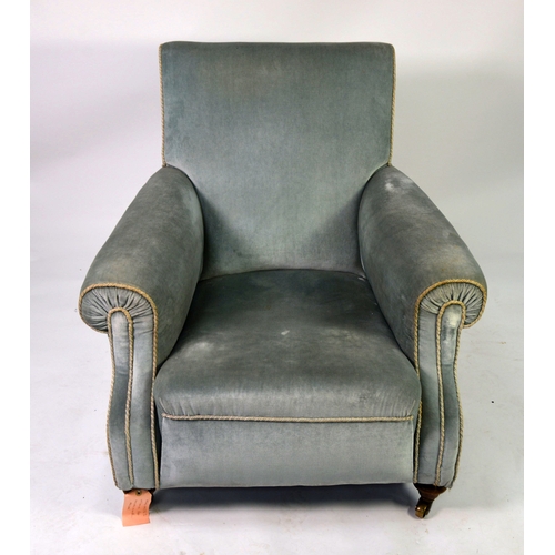 73 - A HOWARD STYLE ARMCHAIR covered in light blue fabric raised on turned front legs