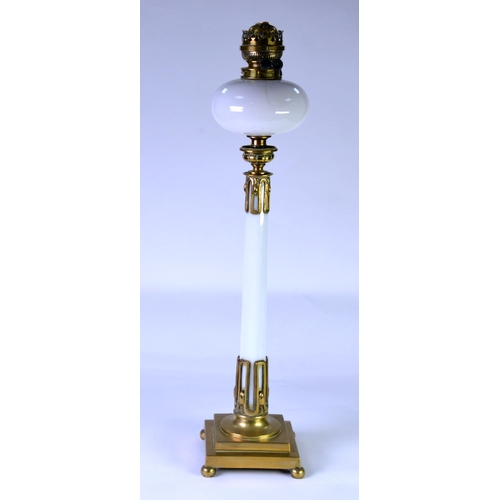 42 - LATE VICTORIAN/EDWARDIAN TALL OIL LAMP, the stepped brass base supporting a column in OPAQUE WHITE G... 