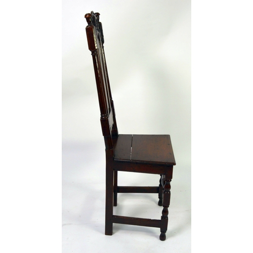 52 - LATE STUART PERIOD OAK HIGH-BACK CHAIR, the back with a NARROW ARCHED-TOP FIELDED PANEL between plai... 