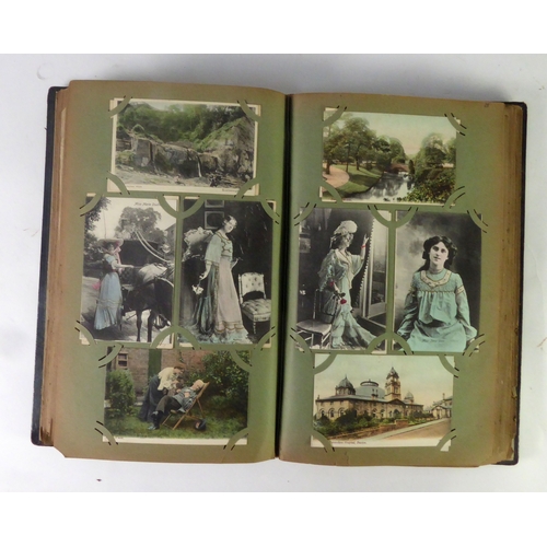 303 - EDWARDIAN BLACK MOROCCO BOUND AND GILT LETTERED POSTCARDS ALBUM, containing a collection of early 20... 