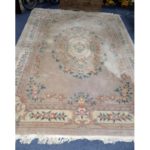 23 - HEAVY QUALITY EMBOSSED WASHED CHINESE CARPET OF AUBUSSON DESIGN with plain mushroom coloured field, ... 