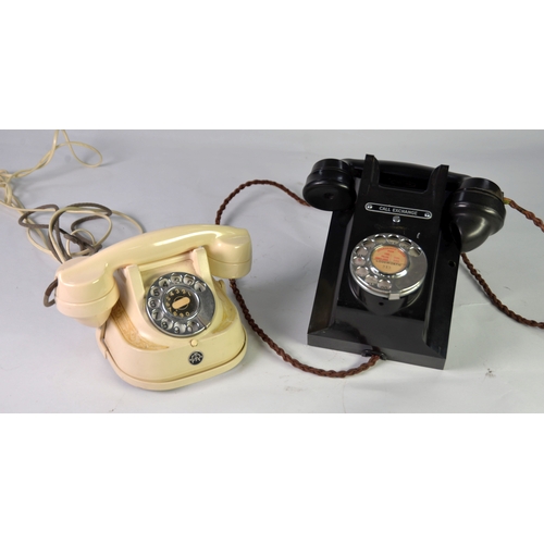 248 - GPO BAKELITE BLACK WALL MOUNTED VINTAGE TELEPHONE, the hand set resting on the top, rotary dial to t... 