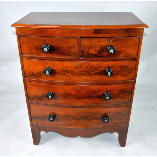 63 - GEORGE III MAHOGANY BOW FRONTED CHEST, with ebonised handles and splay bracket feet, 5 1/2in (105.5c... 