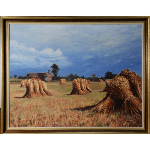 117 - MARGARET BROWN (TWENTIETH/ TWENTY FIRST CENTURY) OIL ON CANVASField of stacked wheatsheaves, farm bu... 