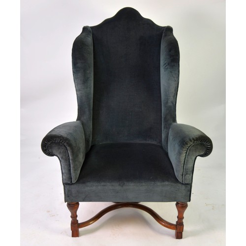 71 - GEORGE III CAMEL BACK WINGED ARMCHAIR covered in dark blue velvet