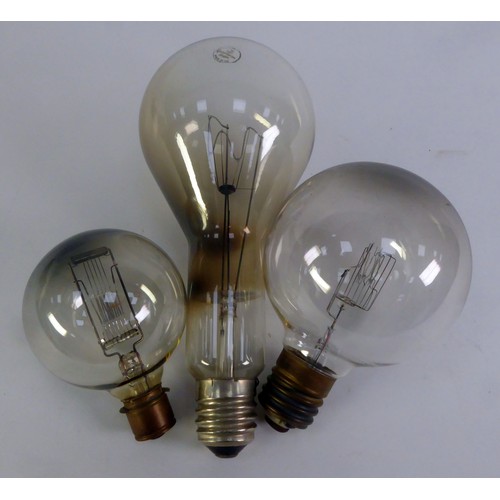 311 - THREE LARGE PLAIN GLASS VINTAGE GLOBE ELECTRIC LIGHT BULBS, one labelled - Crompton made in UK, 1000... 