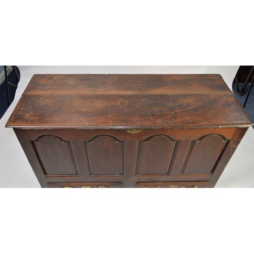 59A - 18th CENTURY OAK DOWER CHEST with lift-up top, four panel front, two short drawers below with brass ... 