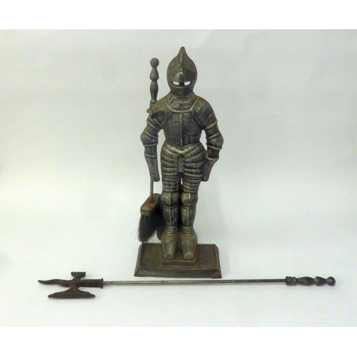 312A - FIRE GUARD: Fireside companion set in cast and wrought iron and modelled as a mediaeval knight with ... 