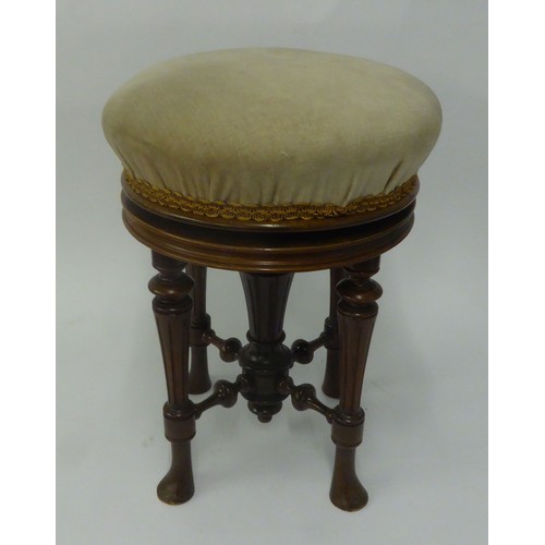 69B - VICTORIAN ROSEWOOD CIRCULAR PIANO STOOL with revolving raised and fall return, the seat upholstered ... 