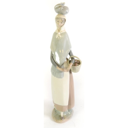 91 - LLADRO PORCLAIN TALL FIGURE of a young woman with a bundle on her head and a carrying a basket 14 1/... 