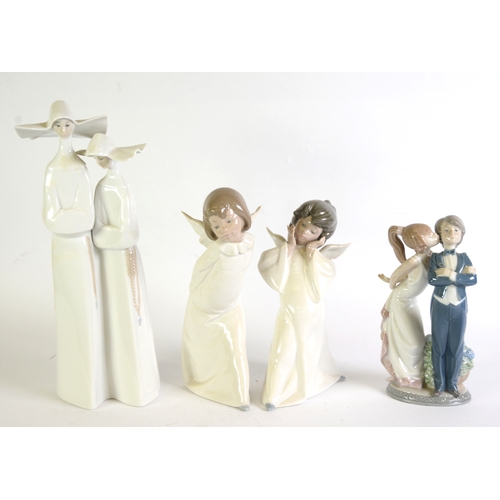 96 - LLADRO PORCELAIN GROUPS OF A YOUNG COUPLE she kissing her beau 81/2