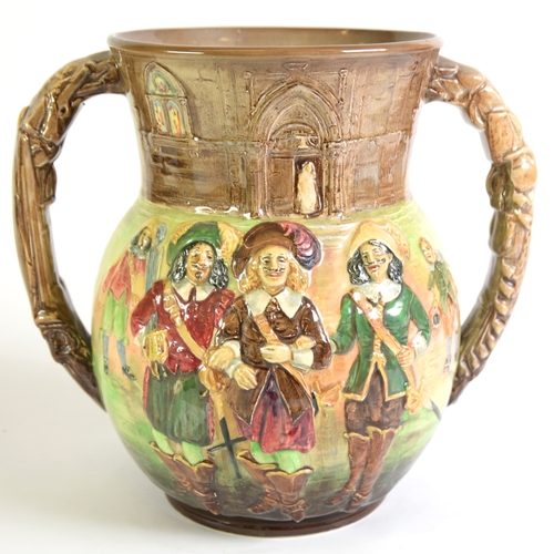 73 - ROYAL DOULTON EMBOSSED POTTERY TWO HANDLE LOVING CUP The Three Musketeers by Dumas, a limited editio... 