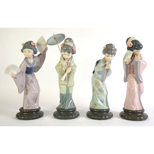 99 - SET OF FOUR LLADRO PORCELAIN FIGURES, of Geishas, on black pedestal style bases, approximately 12in ... 