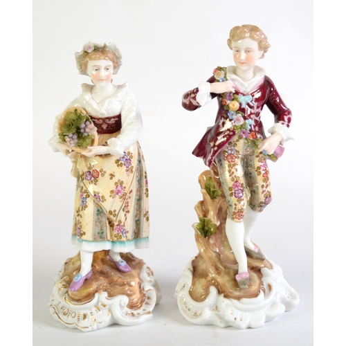 132 - PAIR OF LATE 19th CENTURY VOLKSTEDT, GERMAN, PORCELAIN FIGURE OF A COURTIER AND A WOMAN, carrying a ... 