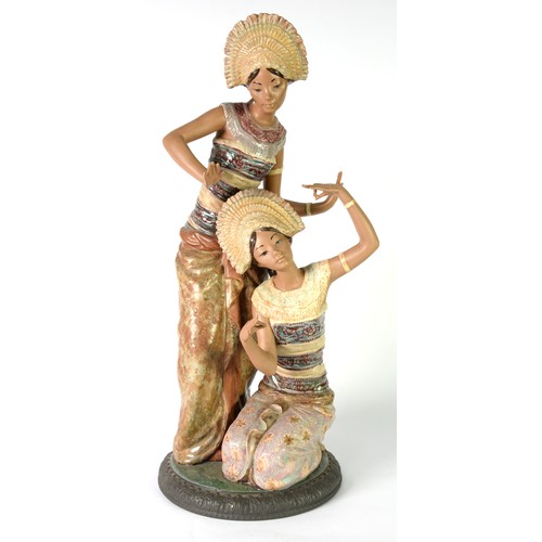 98 - LLADRO PARTLY GLAZED TERRA COTTA LARGE GROUP OF TWO THAI FEMALE DANCERS in traditional costume, on c... 