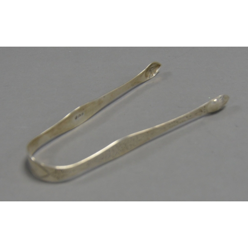 402 - PAIR OF GEORGE III BRIGHT CUT SILVER SUGAR TONGS BY PETER AND ANN BATEMAN, initialled, 5 ½” (14cm) l... 