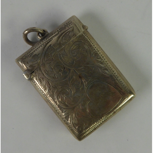 512 - EDWARDIAN SILVER OBLONG VESTA CASE, foliate scroll engraved with ring hanger to the top, Birmingham ... 