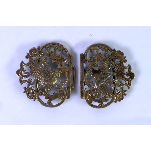 513 - A NURSE'S SILVER TWO-PART BUCKLE, cast and pierced with two birds in flight, flowers and foliate scr... 