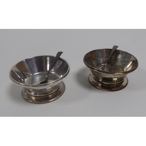 380 - PAIR OF SILVER CIRCULAR SALT RECEIVERS, with sloping straight sides, on cushion knop and circular fo... 