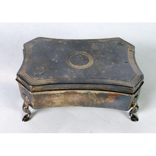 457 - GEORGE V SILVER TRINKET BOX, of shaped oblong form with engine turned border to the flat cover, pale... 