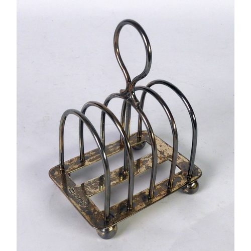 462 - VICTORIAN SILVER FOUR DISVISION BACHELOR’S TOAST RACK BY MAPPIN & WEBB, with loop handle and bal... 