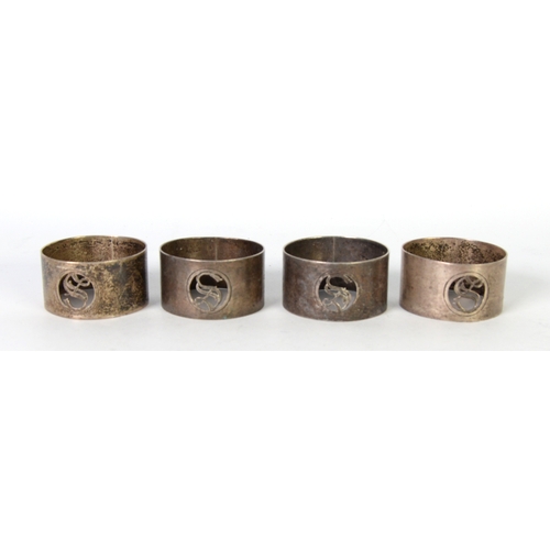 490 - GEORGE V SET OF FOUR PLAIN SILVER NAPKIN RINGS, each with pierced initial S, Chester 1925 (3) and Bi... 