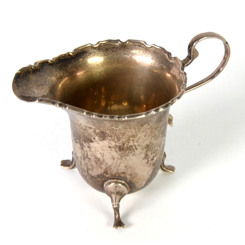 508 - GEORGE VI SILVER CREAM JUG BY FINNIGANS Ltd, with high scroll handle, raised cyma border and trefoil... 