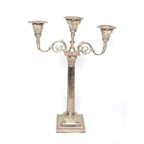 555 - ELECTROPLATED THREE LIGHT, TWIN BRACNCH CANDELABRUM, of Corinthian column form with square base, the... 