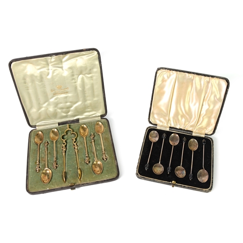 427 - TWO CASED SETS OF SILVER CUTLERY, comprising: SET OF SIX SILVER GILT COFFEE SPOONS AND THE MATCHING ... 