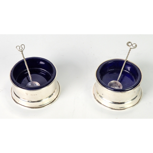 431 - GEORGE V PAIR OF SILVER OPEN SALTS, each of plain circular form with blue glass liners, 2 ¼” (5.7cm)... 