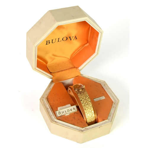 97 - BULOVA GOLD PLATED LADY'S WRIST WATCH with integral BARK TEXTURED BRACELET, in box as supplied