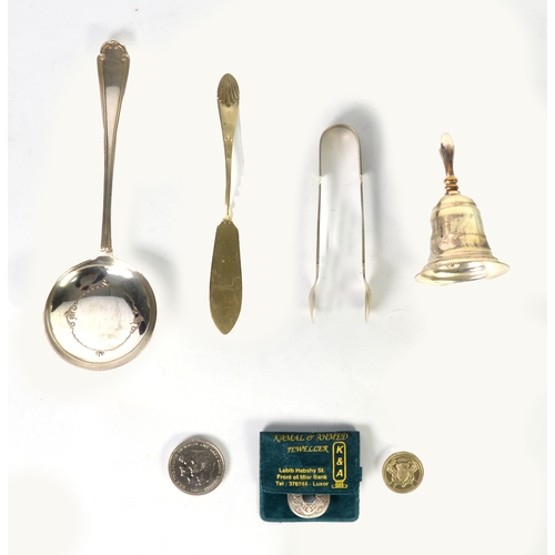 563 - SMALL ELECTRO-PLATED TABLE BELL, a plated serving spoon, pair of sugar tongs, a butter knife, a whit... 