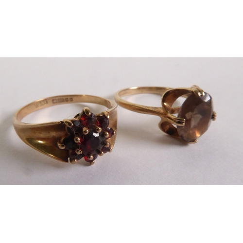 342 - 9ct GOLD RING, set with an oval citrine and a 9ct GOLD RING set with a cluster of garnets, 5gms tota... 